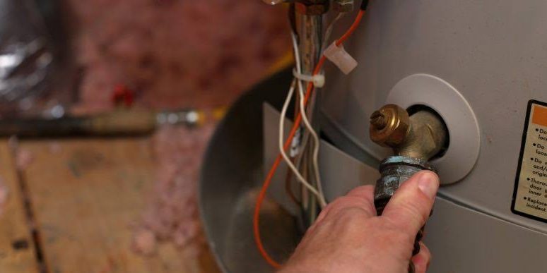 Preventing Leaks There's an easy way to keep your water heater from leaking: At least once a year, grab a large bucket, attach a hose to the drain and empty the tank. Then, simply allow the unit to refill. This process prevents sediment from building up in the appliance. This east maintenance will help the heater last longer and continue to function well. The Results Sediment buildup can cause the water heater's heating elements to fail, so keeping it free of mineral deposits is critical to its health. Paying attention to this home maintenance tip will save you money on your monthly energy bill, and by keeping your water heater clean and well maintained, you won't have to pay a professional for tune-up jobs and repairs.